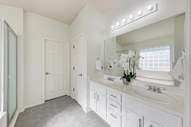 2701 Bolton St, Austin, TX 78748 - full bathroom with double vanity, a shower stall, a bath, tile patterned flooring, and baseboards