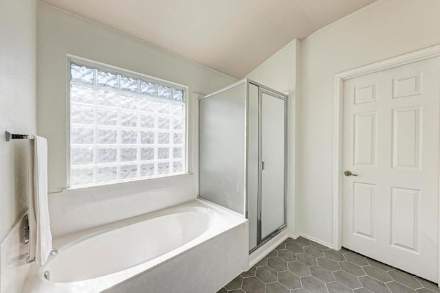 2701 Bolton St, Austin, TX 78748 - bathroom with a bath, a stall shower, and tile patterned floors
