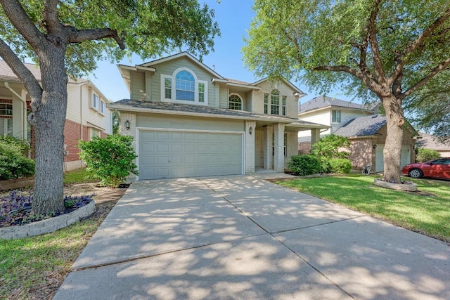2701 Bolton St, Austin, TX 78748 - traditional home featuring an attached garage, concrete driveway, and brick siding