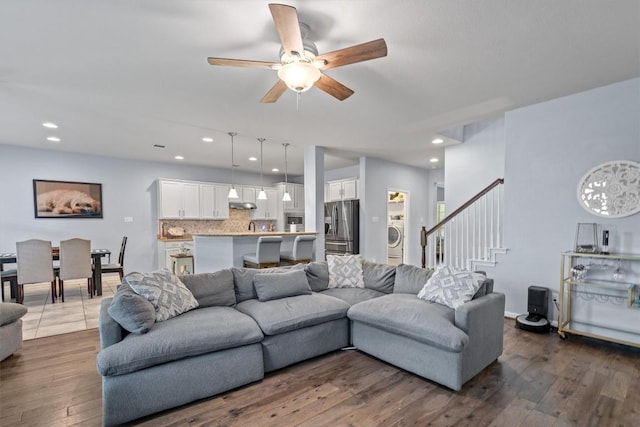 13625 Glen Creek Ct, Manor, TX 78653 - living area featuring ceiling fan, dark wood-style flooring, stairs, recessed lighting, and washer / clothes dryer