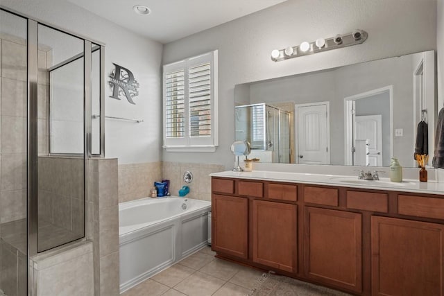 13625 Glen Creek Ct, Manor, TX 78653 - full bathroom featuring a stall shower, double vanity, a bath, and tile patterned floors