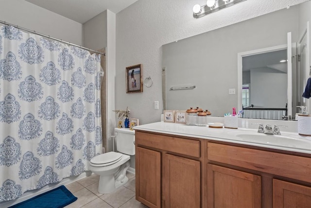 13625 Glen Creek Ct, Manor, TX 78653 - bathroom featuring tile patterned floors, toilet, vanity, curtained shower, and a textured wall
