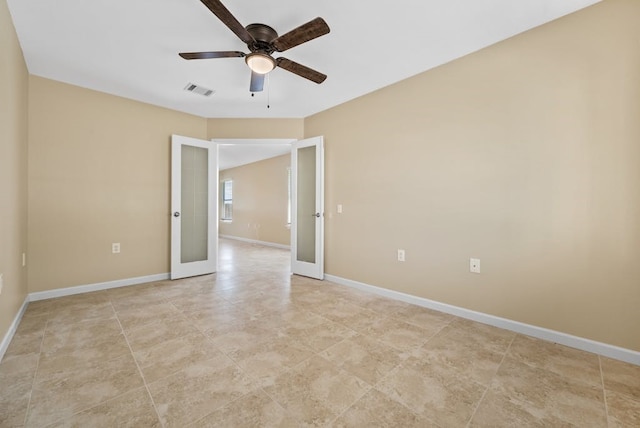 6317 Vida Nueva Ave, Del Valle, TX 78617 - empty room featuring french doors, a ceiling fan, and light tile patterned floors