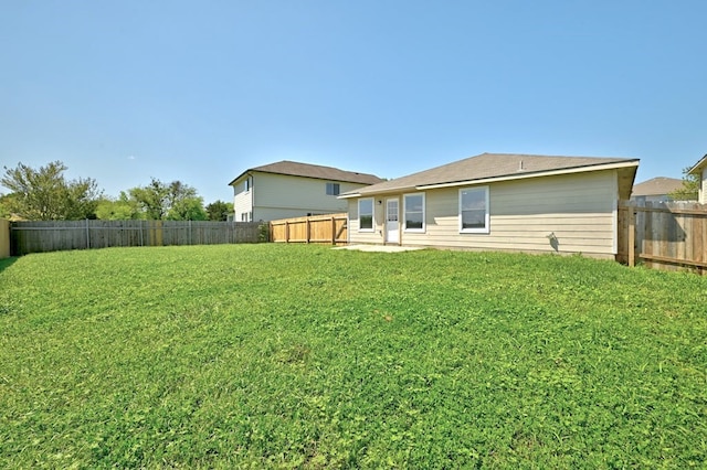 6317 Vida Nueva Ave, Del Valle, TX 78617 - rear view of house featuring a fenced backyard