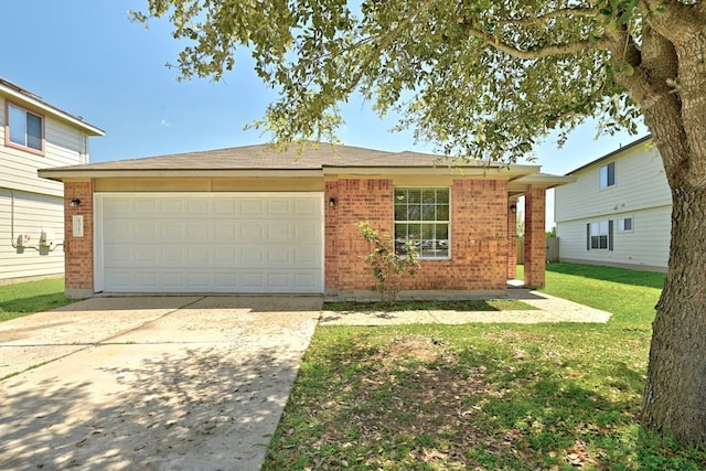 6317 Vida Nueva Ave, Del Valle, TX 78617 - view of front of property with brick siding, a garage, driveway, and a front yard