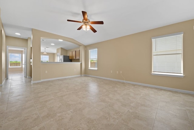 6317 Vida Nueva Ave, Del Valle, TX 78617 - unfurnished living room featuring ceiling fan and light tile patterned floors