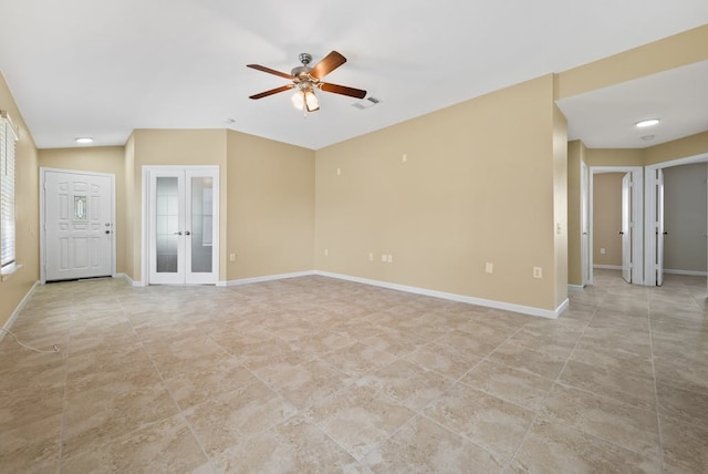 6317 Vida Nueva Ave, Del Valle, TX 78617 - empty room with french doors, a ceiling fan, and light tile patterned flooring