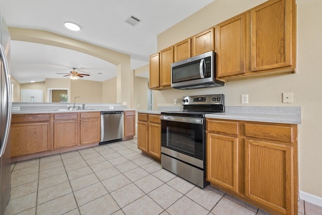 6317 Vida Nueva Ave, Del Valle, TX 78617 - kitchen featuring appliances with stainless steel finishes, a ceiling fan, light countertops, and light tile patterned floors