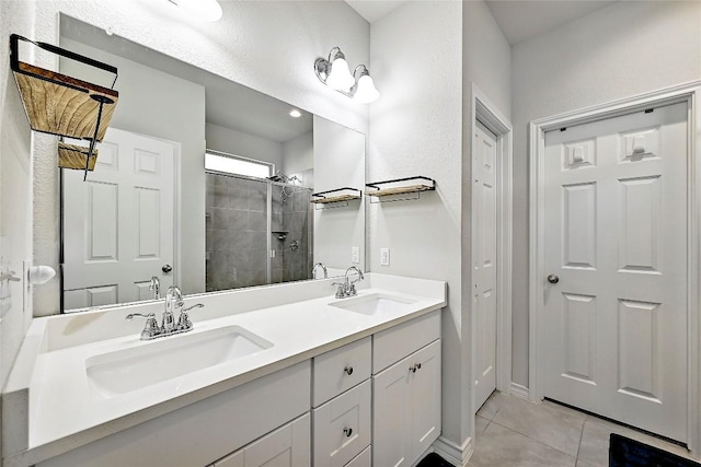 1304 Eagle Ridge Trl, Leander, TX 78641 - full bathroom with double vanity, a tile shower, and tile patterned floors