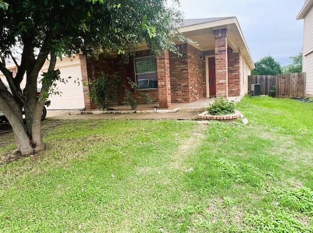 5105 Bantom Woods Bnd, Austin, TX 78724 - view of front of house featuring brick siding, a garage, covered porch, and central air condition unit