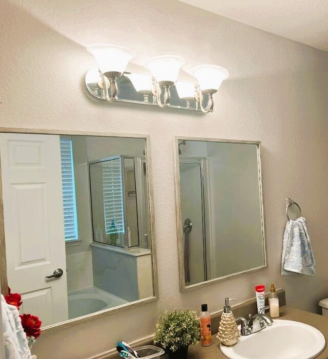 5105 Bantom Woods Bnd, Austin, TX 78724 - full bath with a sink, a shower with shower door, a bathtub, and toilet