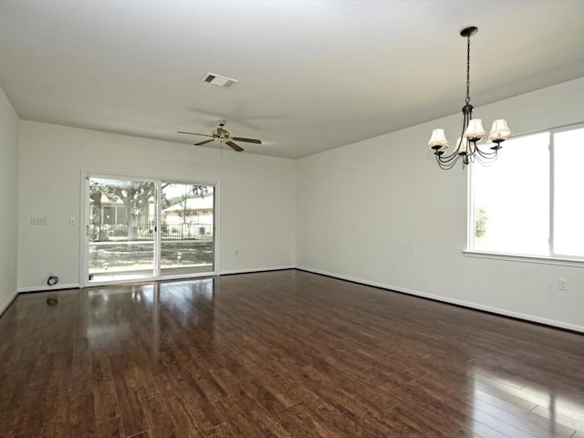 708 Texas Dr, Georgetown, TX 78633 - unfurnished room featuring dark wood finished floors, a chandelier, a ceiling fan, and baseboards