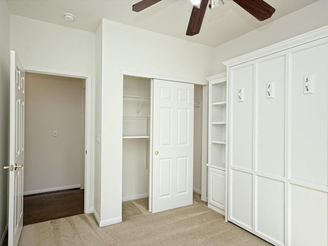 708 Texas Dr, Georgetown, TX 78633 - unfurnished bedroom with light carpet, baseboards, and a ceiling fan