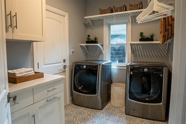 1004 Ruth Ave, Austin, TX 78757 - washroom featuring washer and dryer, cabinet space, and light tile patterned floors