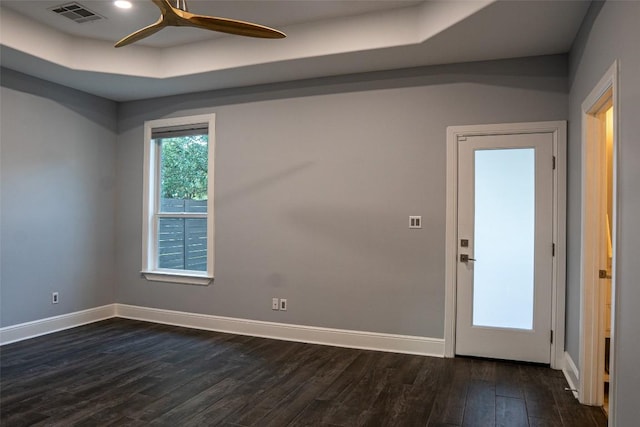 1004 Ruth Ave, Austin, TX 78757 - unfurnished room featuring dark wood-type flooring, a ceiling fan, and baseboards