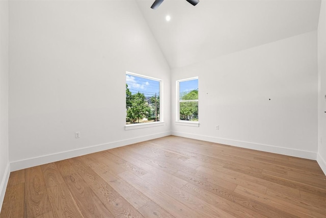 1305 Walnut Ave, Austin, TX 78702 - empty room featuring high vaulted ceiling, baseboards, a ceiling fan, light wood-style floors, and recessed lighting