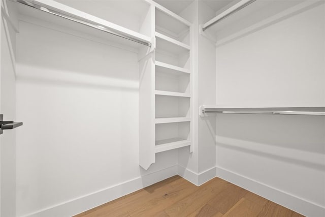 1305 Walnut Ave, Austin, TX 78702 - walk in closet with wood finished floors