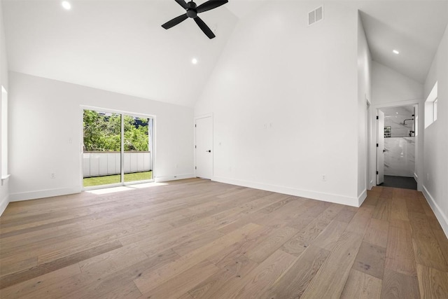 1305 Walnut Ave, Austin, TX 78702 - unfurnished living room with high vaulted ceiling, light wood-style floors, a ceiling fan, recessed lighting, and baseboards