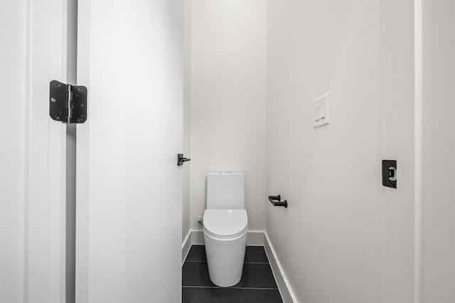 1305 Walnut Ave, Austin, TX 78702 - bathroom with tile patterned flooring, toilet, and baseboards