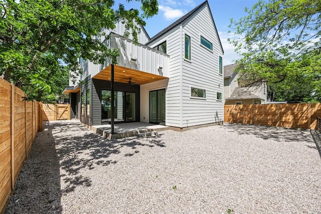 1305 Walnut Ave, Austin, TX 78702 - rear view of property featuring a balcony, a ceiling fan, a patio area, and a fenced backyard
