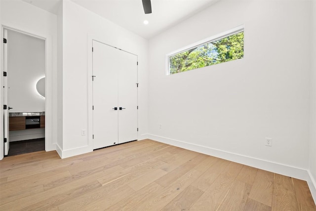 1305 Walnut Ave, Austin, TX 78702 - unfurnished bedroom featuring light wood-style flooring, baseboards, ensuite bath, ceiling fan, and recessed lighting