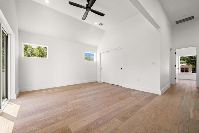 1305 Walnut Ave, Austin, TX 78702 - spare room with healthy amount of natural light, light wood-style flooring, ceiling fan, and high vaulted ceiling