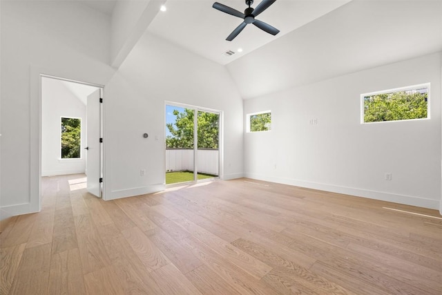 1305 Walnut Ave, Austin, TX 78702 - unfurnished room with healthy amount of natural light, light wood-style flooring, baseboards, and high vaulted ceiling
