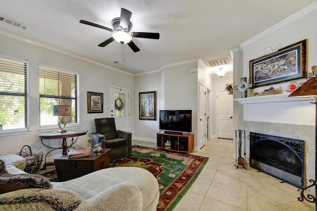 9912 Little Creek Cir, Dripping Springs, TX 78620 - living area with ornamental molding, ceiling fan, light tile patterned floors, a fireplace, and baseboards