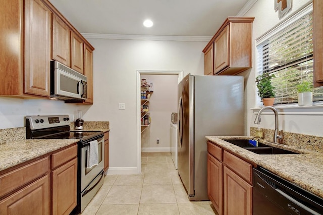 9912 Little Creek Cir, Dripping Springs, TX 78620 - kitchen with stainless steel appliances, a sink, ornamental molding, light stone countertops, and light tile patterned flooring