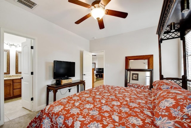 9912 Little Creek Cir, Dripping Springs, TX 78620 - bedroom featuring light carpet, a ceiling fan, and ensuite bath