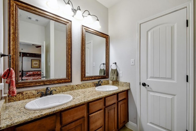 9912 Little Creek Cir, Dripping Springs, TX 78620 - bathroom featuring double vanity and connected bathroom