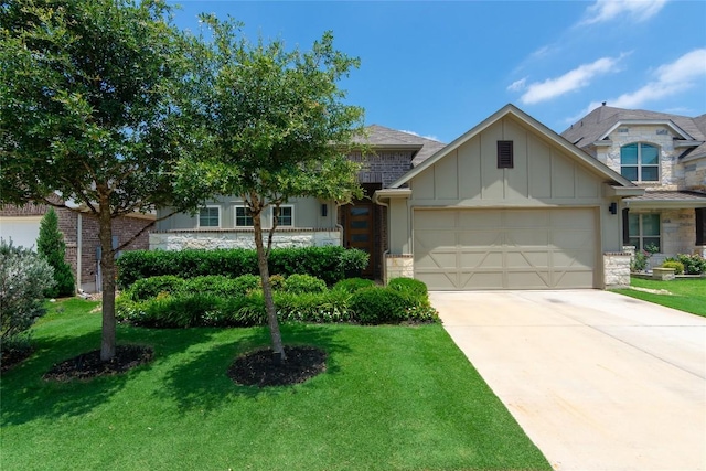 2208 Mcclendon Trl, Leander, TX 78641 - view of front of house with board and batten siding, stone siding, an attached garage, and a front yard