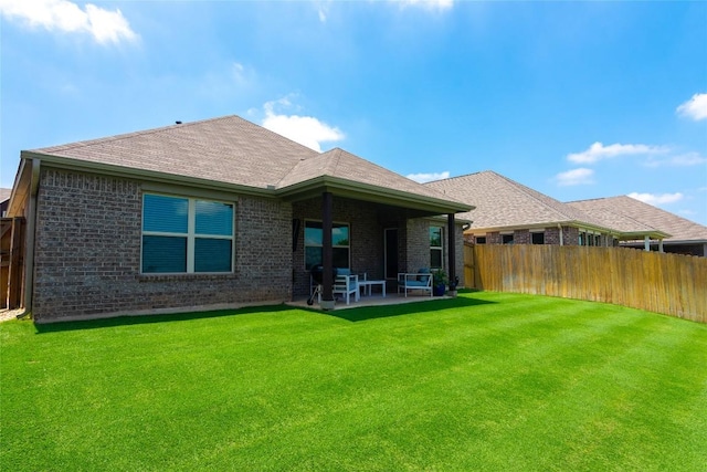 2208 Mcclendon Trl, Leander, TX 78641 - rear view of property featuring brick siding and a patio area