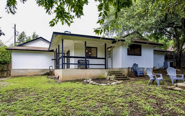 15100 N Flamingo Dr, Austin, TX 78734 - back of property with covered porch and central AC unit