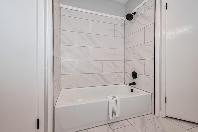 7614 Andiron Cir, Houston, TX 77041 - bathroom featuring bathing tub / shower combination and marble look tile flooring