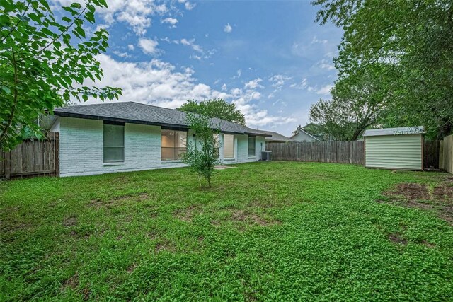7614 Andiron Cir, Houston, TX 77041 - back of house featuring brick siding and central AC unit