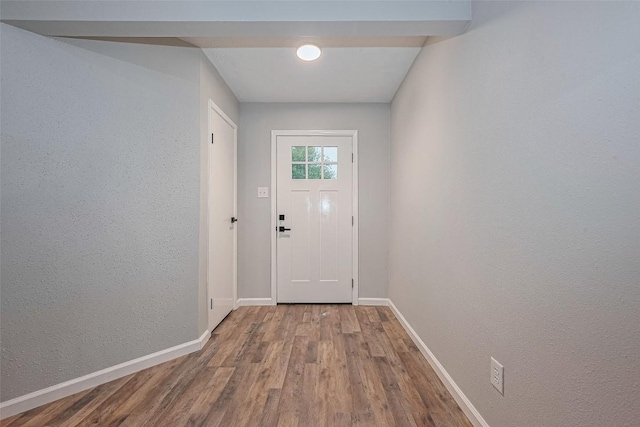 7614 Andiron Cir, Houston, TX 77041 - doorway with wood finished floors, baseboards, and a textured wall