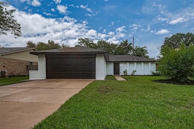 7614 Andiron Cir, Houston, TX 77041 - view of front of home with a front yard, brick siding, and an attached garage