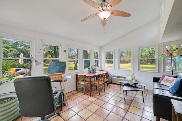 sunroom / solarium with vaulted ceiling, tile patterned flooring, and an AC wall unit