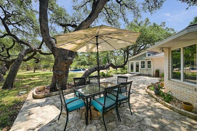 view of patio / terrace with french doors and outdoor dining space