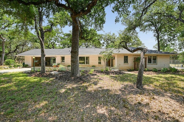 single story home with brick siding