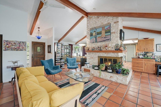 living room featuring beam ceiling, a brick fireplace, light tile patterned floors, and high vaulted ceiling