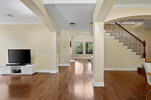 3904 Avery Woods Ln, Cedar Park, TX 78613 - entrance foyer featuring arched walkways, hardwood / wood-style flooring, stairway, baseboards, and ornamental molding