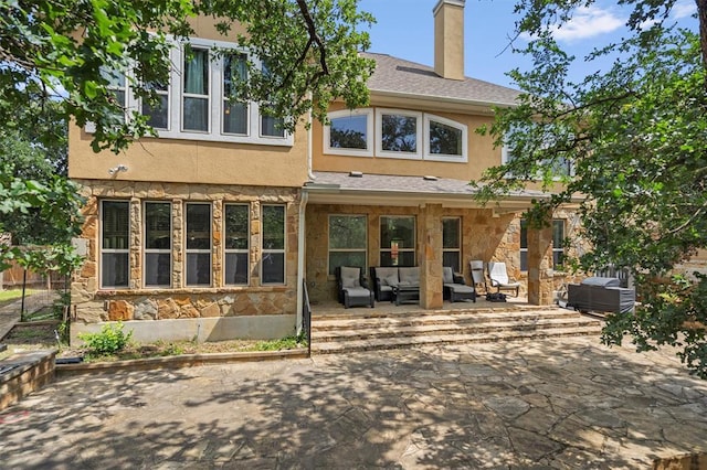 3904 Avery Woods Ln, Cedar Park, TX 78613 - back of house with stone siding, an outdoor living space, a patio, and stucco siding