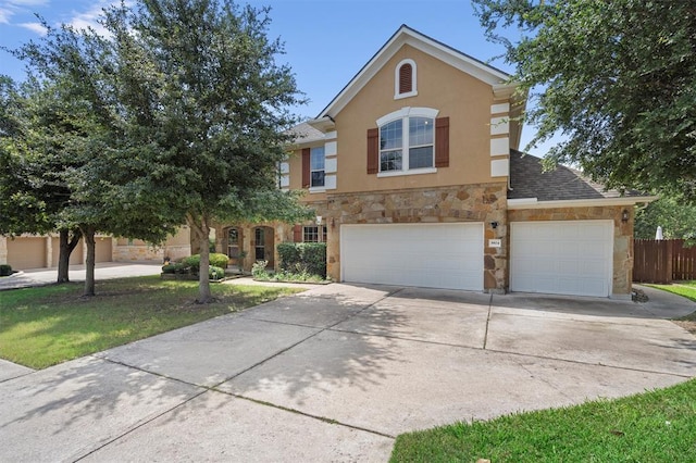 3904 Avery Woods Ln, Cedar Park, TX 78613 - view of front of home with driveway, stone siding, an attached garage, and stucco siding