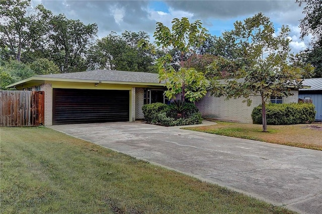 1706 Ridgemont Dr, Austin, TX 78723 - ranch-style home featuring brick siding, an attached garage, and concrete driveway