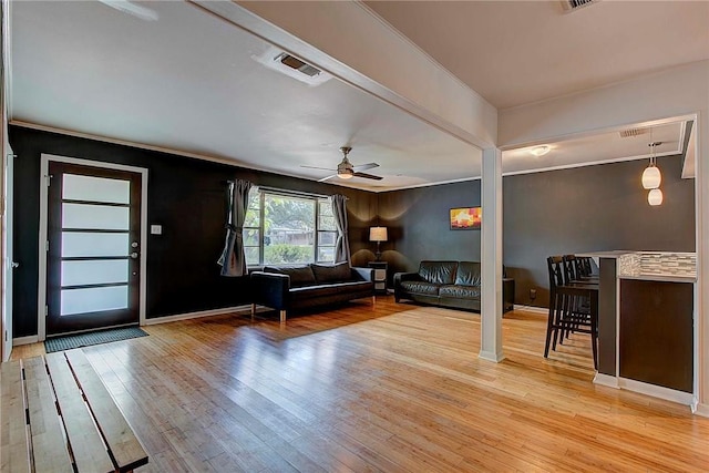 1706 Ridgemont Dr, Austin, TX 78723 - living area with light wood finished floors, a ceiling fan, and ornamental molding