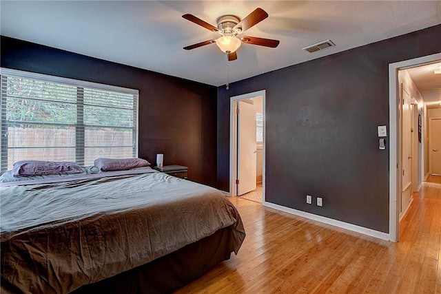 1706 Ridgemont Dr, Austin, TX 78723 - bedroom with light wood-style floors, baseboards, and ceiling fan
