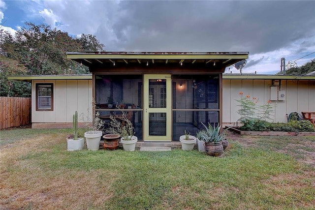 1706 Ridgemont Dr, Austin, TX 78723 - back of property featuring a sunroom and board and batten siding