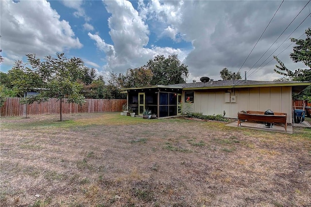 1706 Ridgemont Dr, Austin, TX 78723 - back of house with a sunroom and board and batten siding
